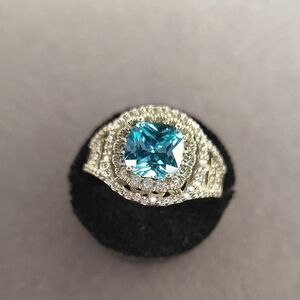 Sterling Silver Halo Ring with Blue Topaz Stone